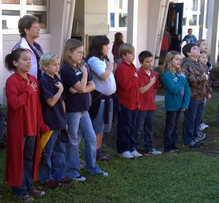 The school warns children not to chant “USA,” but when they do, officials regret it.