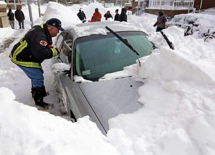 He was in the car with his wife and two kids, but he started getting out to shovel snow off the front of the car.