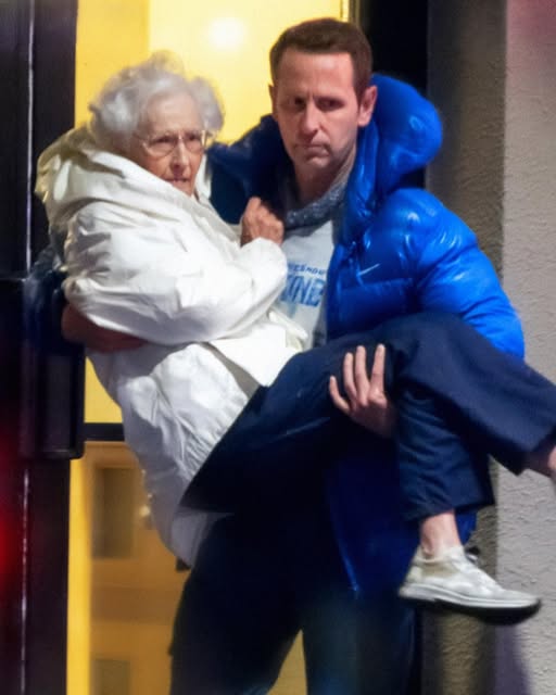 I Carried My Elderly Neighbor down Nine Flights During a Fire – Two Days Later, a Man Showed Up at My Door and Said, ‘You Did It on Purpose!’