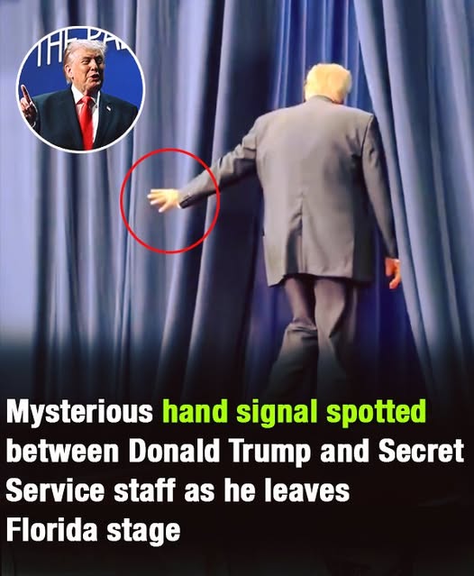 A hand gesture between Donald Trump and Secret Service personnel drew attention as he left a Florida stage.